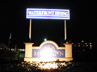 After photo of Marina Town Village sign installation